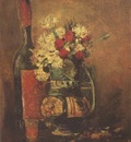 vase with carnations and roses and a bottle, paris