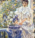 reid woman on a porch with flowers c1906