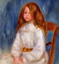 seated little girl with a blue background