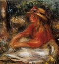 young woman seated on the grass